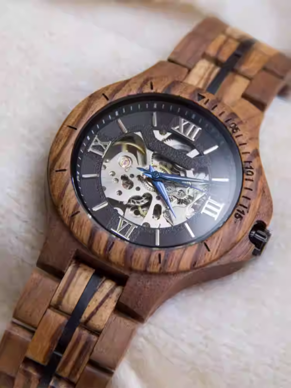 Black and gold transparent round skeletonized wooden men's automatic winding wooden watch with gold hands.